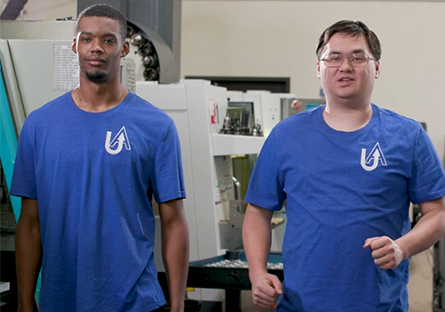 Two make students in blue shirts