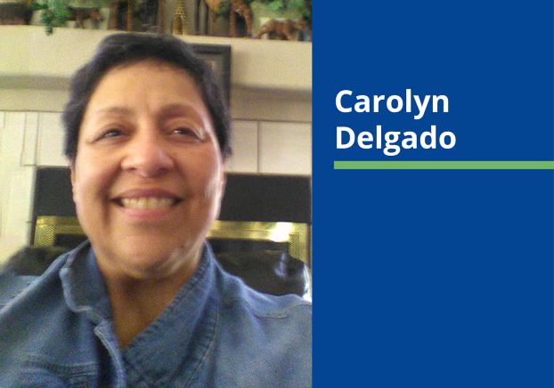 Image of female wearing a denim button down shirt, two her right a blue rectangle with the name Carolyn Delgado in white font.