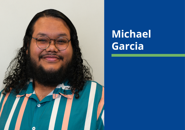 Photo of male with black curly hair wearing a teal striped shirt. With a solid blue background and the name Michael Garcia in white text.